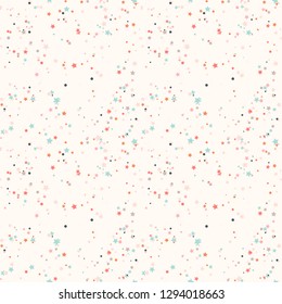 Abstract seamless pattern with colorful chaotic small circles and stars on beige. Infinity geometric pattern. Vector illustration.     