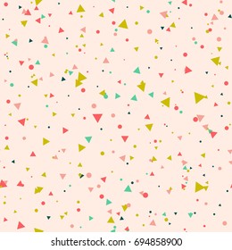 Abstract seamless pattern with colorful green, red, yellow chaotic small circles and triangles on pink. Infinity geometric pattern. Vector illustration.  