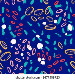 Abstract seamless pattern with colorful oval brush strokes on blue background. Stylish backdrop with paint marks, daub or stains. Hand painted vector illustration for textile print, wrapping paper.