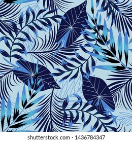 Abstract seamless pattern with colorful tropical leaves and plants on blue background. Vector design. Jungle print. Floral background. Printing and textiles. Exotic tropics. Summer design.