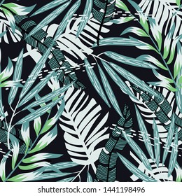 Abstract seamless pattern with colorful tropical leaves and plants on black background. Vector design. Jungle print. Floral background. Printing and textiles. Exotic tropics. Summer design.