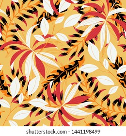 Abstract seamless pattern with colorful tropical leaves and plants on yellow background. Vector design. Jungle print. Floral background. Printing and textiles. Exotic tropics. Summer design.
