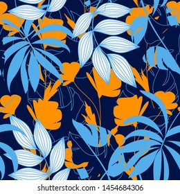 Abstract seamless pattern with colorful tropical leaves and plants on dark background. Vector design. Jungle print. Flowers background. Printing and textiles. Exotic tropics. Fresh design.