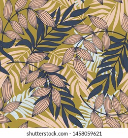 Abstract seamless pattern with colorful tropical leaves and plants on mustard background. Vector design. Jungle print. Flowers background. Printing and textiles. Exotic tropics. Fresh design.