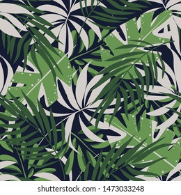 Abstract seamless pattern with colorful tropical leaves and plants on blue background. Vector design. Jungle print. Floral background. Printing and textiles. Exotic tropics. Summer.