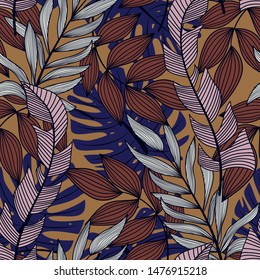 Abstract seamless pattern with colorful tropical leaves and plants on brown background. Vector design. Jungle print. Floral background. Printing and textiles. Exotic tropics. Summer.