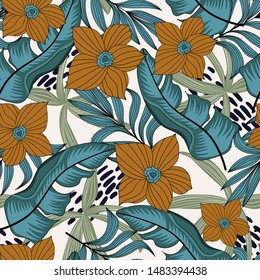 Abstract seamless pattern with colorful tropical leaves and flowers on white background. Vector design.Exotic tropics. Summer. Jungle print. Floral background. Printing and textiles.