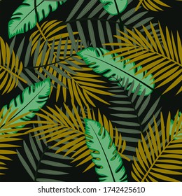 Abstract seamless pattern with colorful tropical leaves and plants on black background. Vector design. Jungle print. Floral background. Printing and textiles. Exotic tropics. Summer.