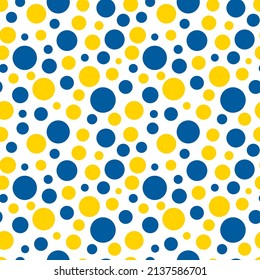 Abstract seamless pattern consisting of large small circles of different sizes in yellow and blue on a white background.  Colors of Ukrainian flag. protest against war, support for Ukraine