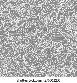 Abstract seamless pattern with elements of tropic fruit and flowers. White lace on the grey background.