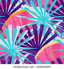 Abstract seamless pattern of exotic palm leaves in vivid colors. Bright vector design drawn in the technique of rough brush