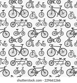 Abstract seamless pattern with hand drawn bicycles. Monochrome bikes ornament. Cute black and white bicycles background 