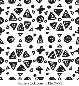 Abstract Seamless pattern with hand drawn shapes circles, crosses and triangles. Ink doodles. Black and white background.