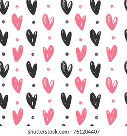 Abstract seamless pattern with hand drawn hearts. Ink illustration.
