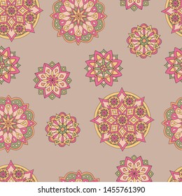 Abstract seamless pattern of hand-drawn mandalas in beautiful colors on brown background
