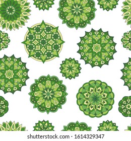 Abstract seamless pattern of hand-drawn mandalas in green colors on white background, for the design of covers, packaging, print on textiles, wallpaper, fabric
