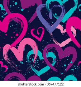 Abstract seamless pattern with hearts. Pink and blue wallpaper for girls. Grunge background with bright colors hearts and spay paint