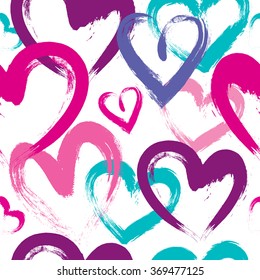 Abstract seamless pattern with hearts. Pink and blue wallpaper for girls. Tender background with bright colors, hearts and spay paint