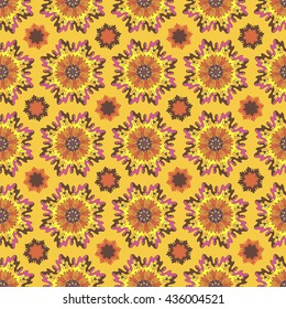 Abstract seamless pattern with hearts,floral,ethnic elements.Vector illustration with fantasy circular patterns.Orange,yellow.Print for Wallpaper,fabrics,textile,wrapping paper.