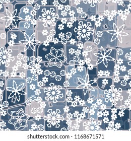 Abstract seamless pattern of ice colors on a background of various snowflakes of different sizes.