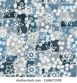 Abstract seamless pattern of ice colors on a background of various snowflakes of different sizes.