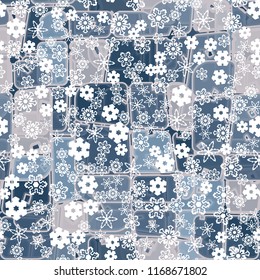 Abstract seamless pattern of ice colors on a background of a variety of snowflakes.