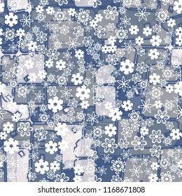 Abstract seamless pattern of ice colors on a background of a variety of snowflakes.