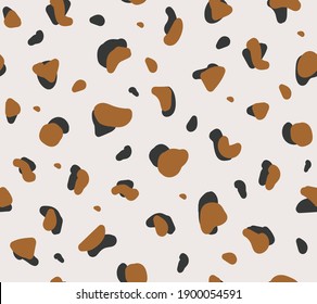 Abstract seamless pattern with irregular geometric shapes on light background. Vector design wild animal skin