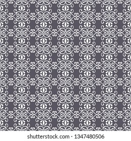 Abstract seamless pattern with lacy leaves, flowers and swirls in geometric layout. Grey and white vector illustration.
