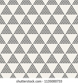 Abstract seamless pattern. Modern stylish texture. Repeating geometric tiles with dotted triangles. Simple minimalistic vector background. Small circles form triangular minimalistic ornament.