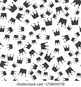 Abstract seamless pattern with monochrome crown elements. Vector texture for your design. Simple modern texture with chaotic painted shapes. 