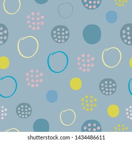 Abstract seamless pattern in multicolored polka dots, repeating circles of different colors