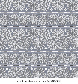Abstract seamless pattern with ornamental stripes from beige spirals on blue background, divided brown dashed lines on white