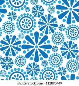 Abstract seamless pattern. Ornamental tiled background of flowers and geometric shapes. Snowflakes textured wallpaper