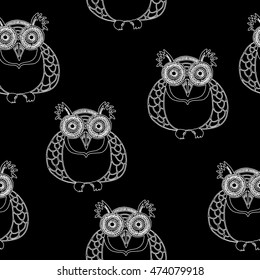 Abstract seamless pattern. Owls repeated backdrop on black background. Creative design for fashion clothes. Original style.