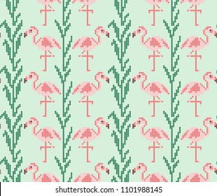 Abstract seamless pattern with pink flamingo and green branches, leaves for embroidery, knitting