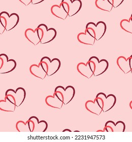 Abstract seamless pattern with pink and red hearts on a pink background. Hand drawn style
