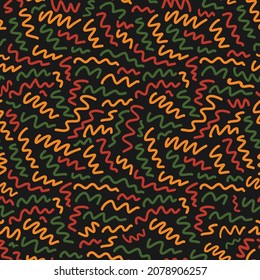 Abstract seamless pattern with random hand drawn scribbles doodle lines in traditional African colors - red, yellow, green on black background. Ethnic backdrop Kwanzaa, Black History Month, Juneteenth