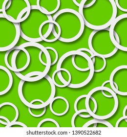 Abstract seamless pattern of randomly arranged white rings with soft shadows on green background