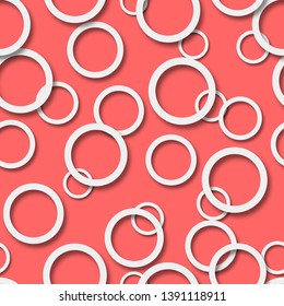 Abstract seamless pattern of randomly arranged white rings with soft shadows on peach background