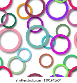 Abstract seamless pattern of randomly arranged colored rings with soft shadows on white background