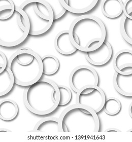 Abstract seamless pattern of randomly arranged gray rings with soft shadows on white background