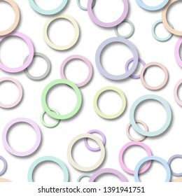 Abstract seamless pattern of randomly arranged colored rings with soft shadows on white background