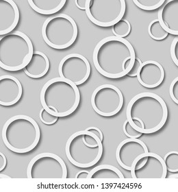 Abstract seamless pattern of randomly arranged white rings with soft shadows on gray background
