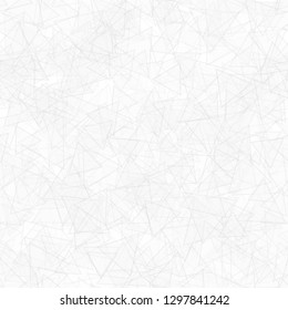 Abstract seamless pattern of randomly distributed translucent triangles in white and gray colors