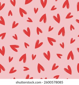 Abstract seamless pattern with red hearts on pink background. Simple cute tile for fabric, Valentine's Day, wedding, and Mother's Day designs. Hand drawn festive print. 