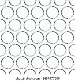 Abstract seamless pattern of repeating round ornaments isolated on white background. Background with dotted circles. Stylish texture. Vector monochrome illustration.