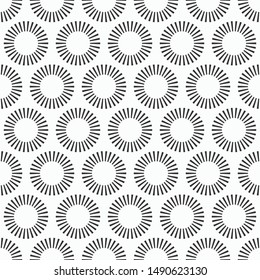 Abstract seamless pattern of repeating round ornaments isolated on white background. Sunburst pattern. Stylish texture. Vector monochrome illustration.