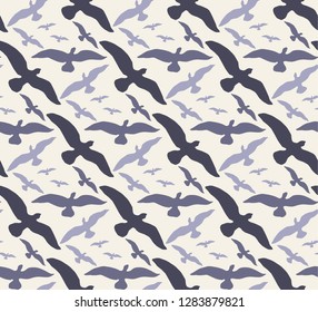 Abstract seamless pattern with silhouettes of birds - a flock of birds in the sky