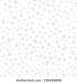 Abstract seamless pattern of small pieces of paper or splinters of ceramics of different sizes in white and gray colors